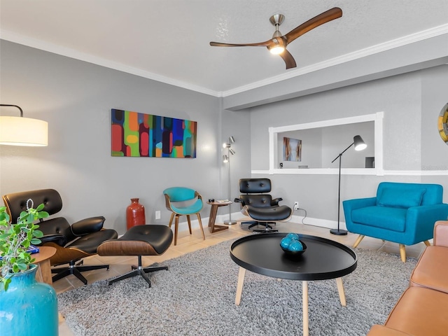 tiled living room featuring ceiling fan and ornamental molding