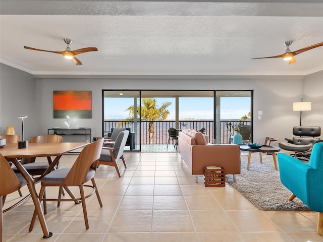 tiled living room with a textured ceiling and ceiling fan