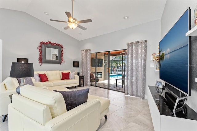 tiled living room featuring ceiling fan and lofted ceiling