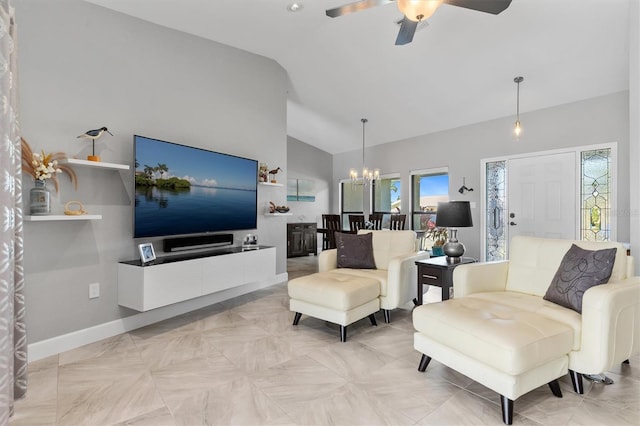 living room featuring ceiling fan with notable chandelier and lofted ceiling