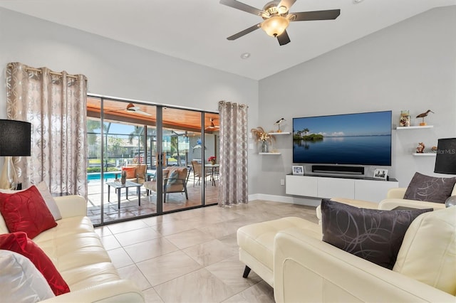 living room featuring ceiling fan and lofted ceiling