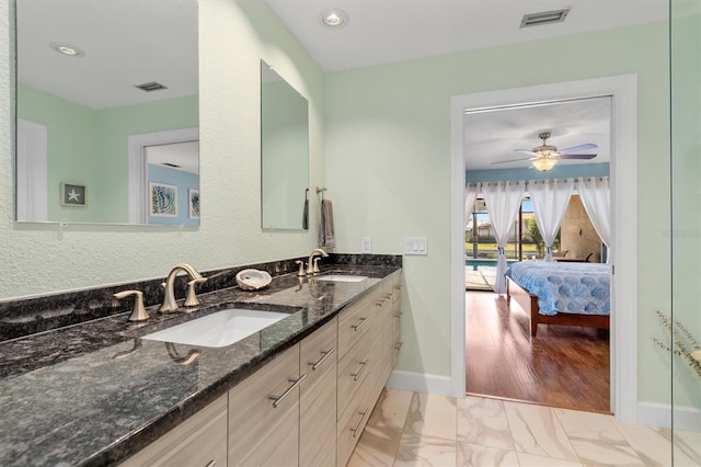 bathroom with vanity and ceiling fan