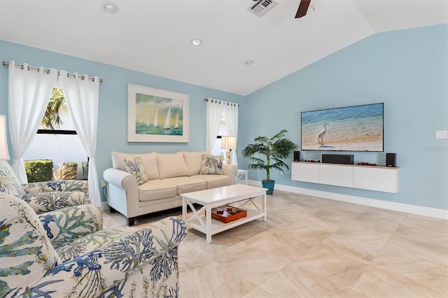 living room featuring ceiling fan and lofted ceiling