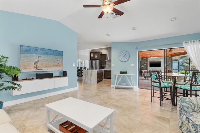 living room with ceiling fan and lofted ceiling