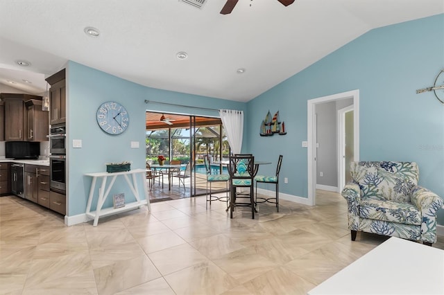 dining space featuring vaulted ceiling and ceiling fan