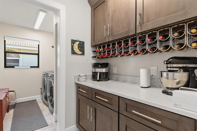 laundry area with independent washer and dryer