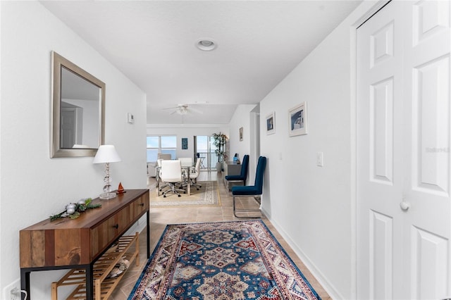 hall with tile patterned flooring