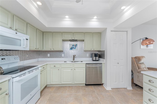 kitchen with backsplash, a raised ceiling, white appliances, light tile patterned flooring, and sink