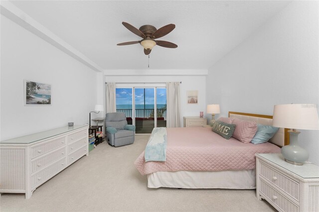 carpeted bedroom featuring ceiling fan and access to exterior