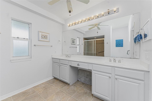 bathroom featuring vanity, ceiling fan, and walk in shower