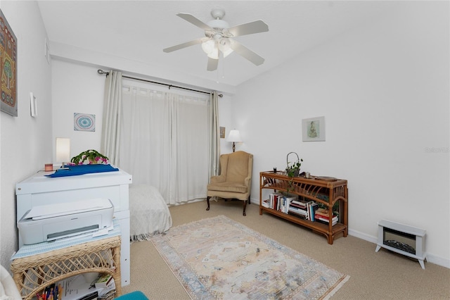 interior space with ceiling fan and carpet flooring