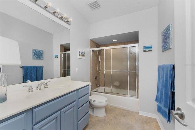 full bathroom with toilet, vanity, tile patterned flooring, and shower / bath combination with glass door