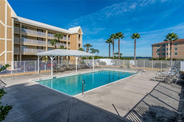 view of pool featuring a gazebo and a patio