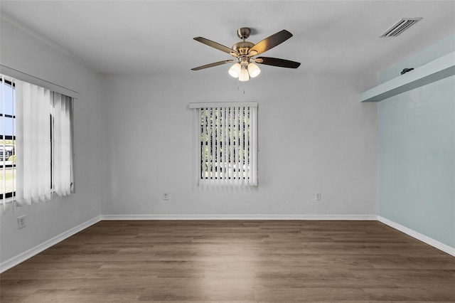 unfurnished room with ceiling fan and wood-type flooring