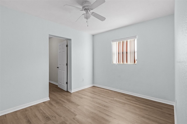 unfurnished room with light wood-type flooring and ceiling fan