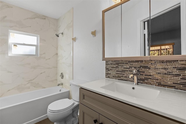 full bathroom with vanity, toilet, tiled shower / bath, and backsplash