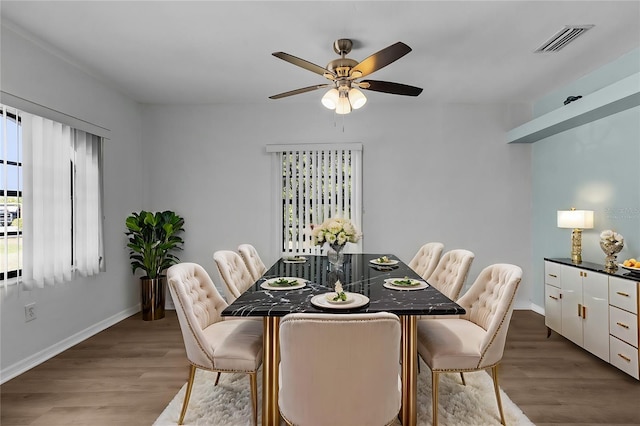 dining room featuring ceiling fan and light hardwood / wood-style floors