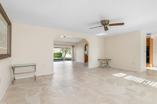 spare room with ceiling fan