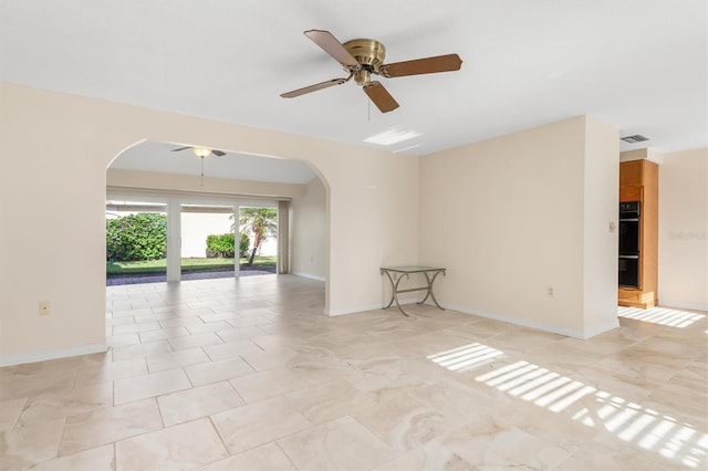 unfurnished room with ceiling fan