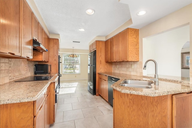 kitchen featuring light stone countertops, sink, kitchen peninsula, light tile patterned floors, and black appliances