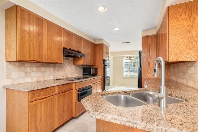 kitchen with sink, tasteful backsplash, kitchen peninsula, light tile patterned floors, and black appliances