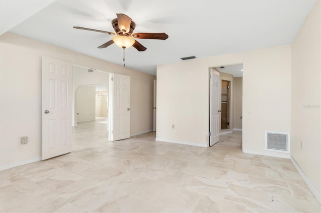 spare room with ceiling fan