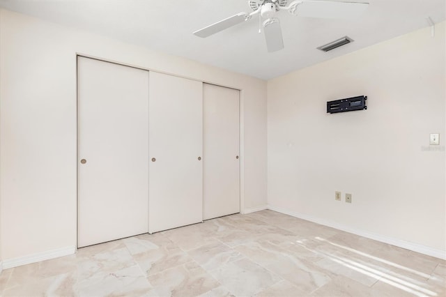 unfurnished bedroom featuring a closet and ceiling fan