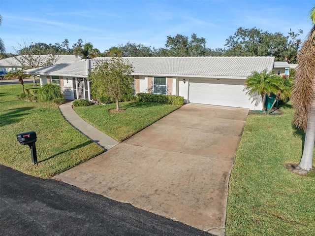 ranch-style home with a front yard and a garage