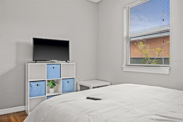 bedroom featuring wood-type flooring