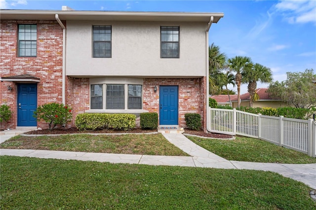 view of front of property with a front lawn