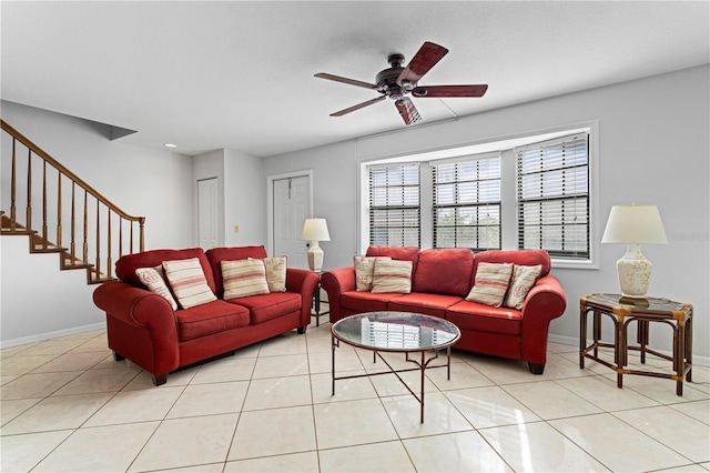 tiled living room with ceiling fan