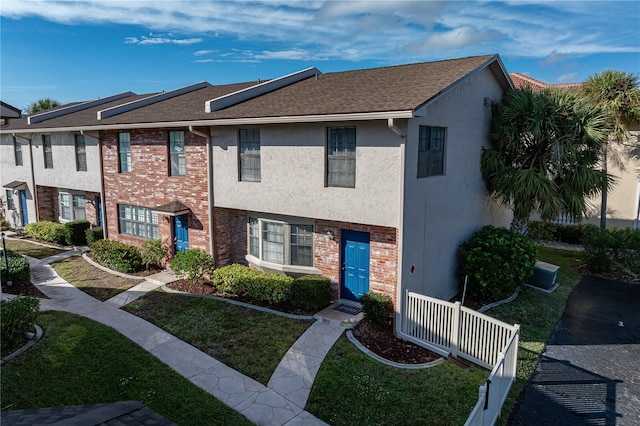 view of property with a front lawn