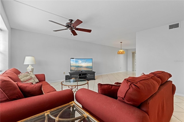 living room featuring ceiling fan and light tile patterned flooring