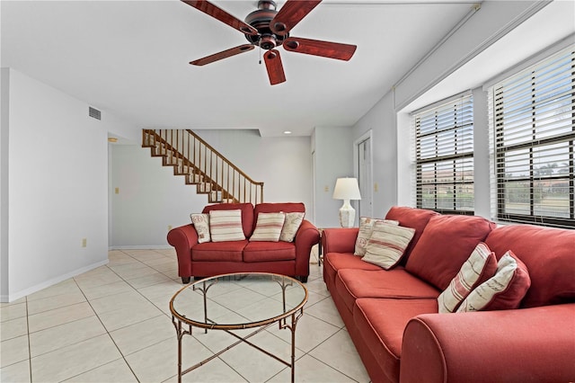 tiled living room featuring ceiling fan