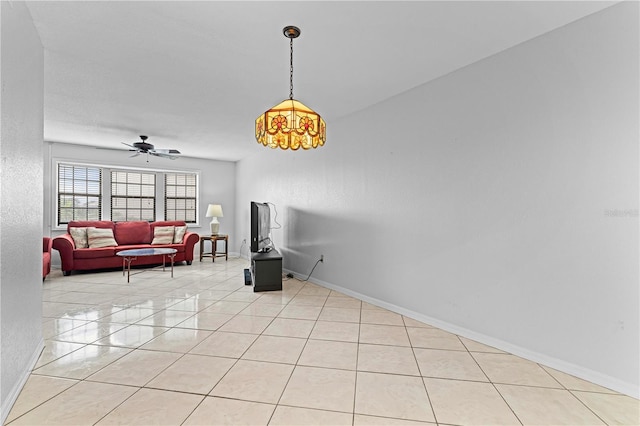 interior space featuring ceiling fan and light tile patterned floors