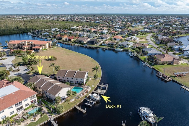 birds eye view of property featuring a water view