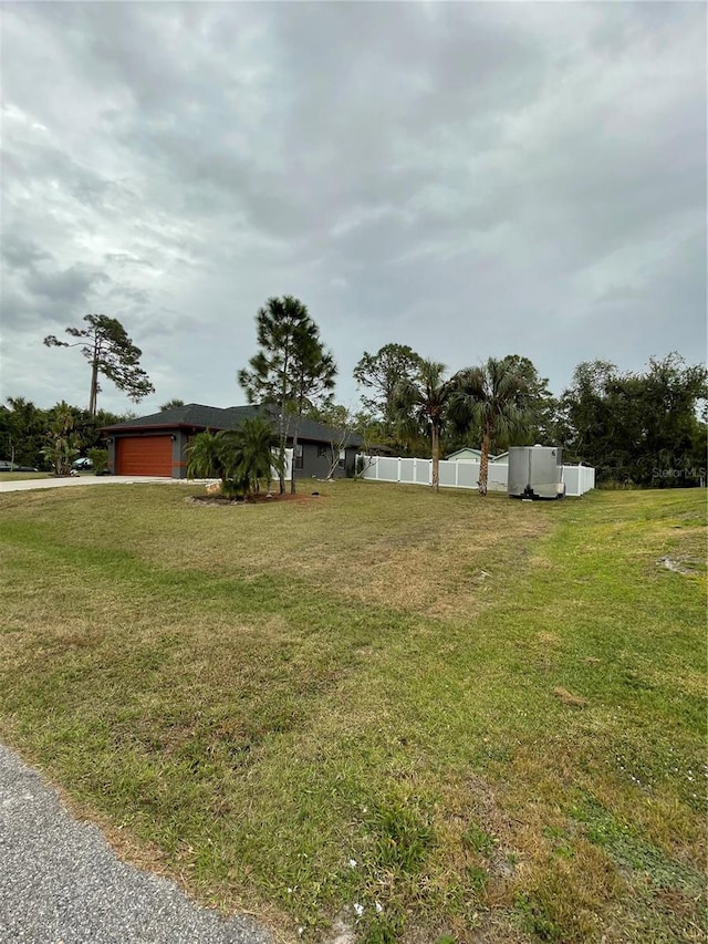 view of yard featuring a garage