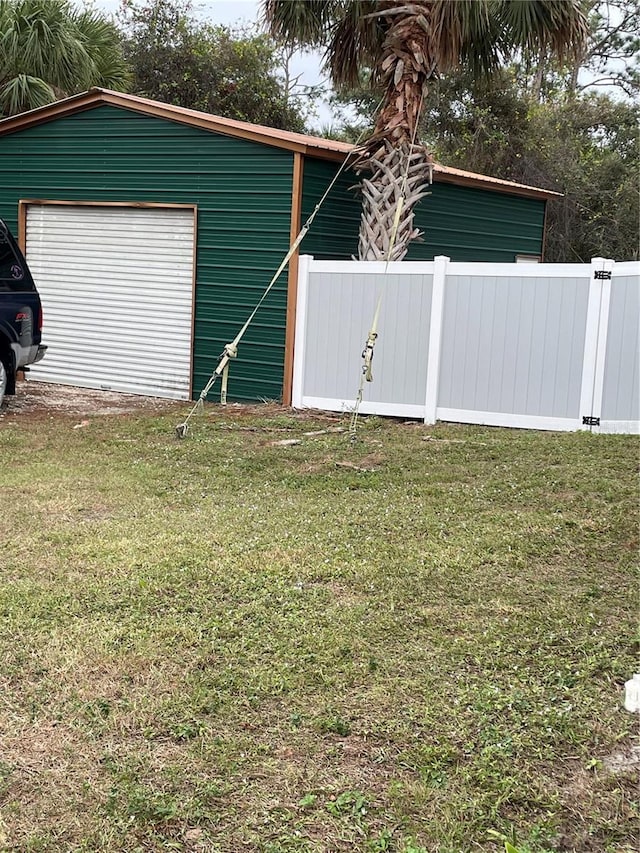 exterior space featuring a yard and a garage