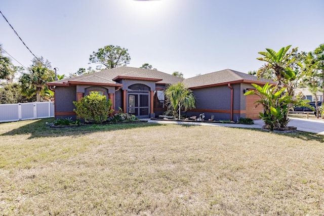 view of front facade featuring a garage and a front yard