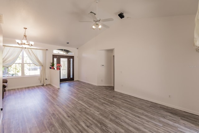 interior space featuring wood-type flooring, ceiling fan with notable chandelier, and high vaulted ceiling