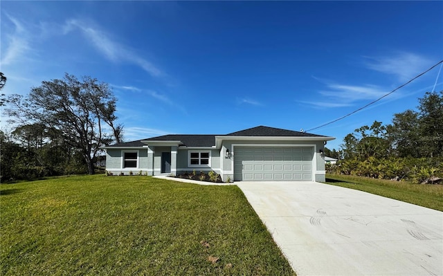 view of front of property with a garage and a front yard