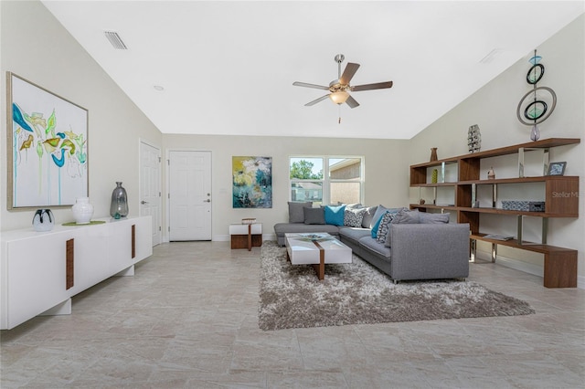 living room with ceiling fan and vaulted ceiling