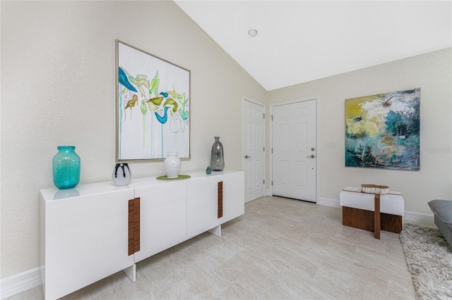 entrance foyer with vaulted ceiling