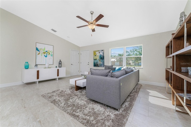 living room featuring ceiling fan, lofted ceiling, and light tile patterned floors