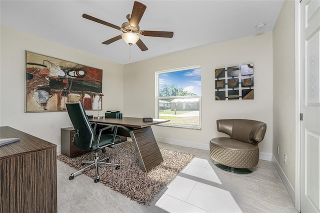 office with ceiling fan and light tile patterned flooring