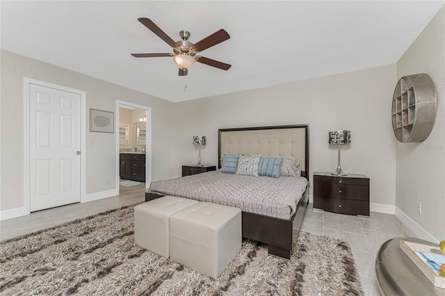 bedroom featuring ceiling fan and connected bathroom