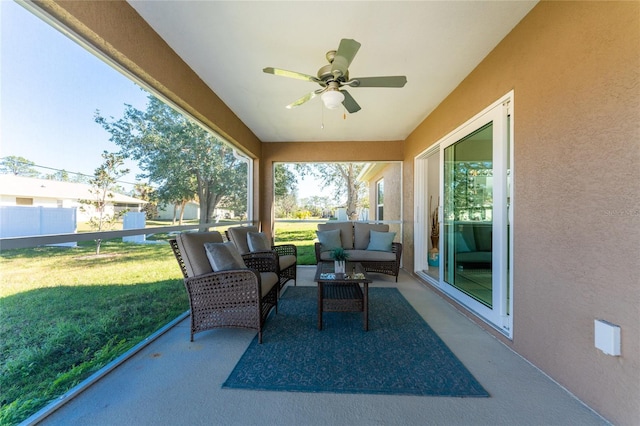 sunroom with ceiling fan