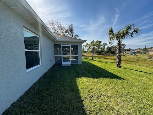 view of yard with a sunroom