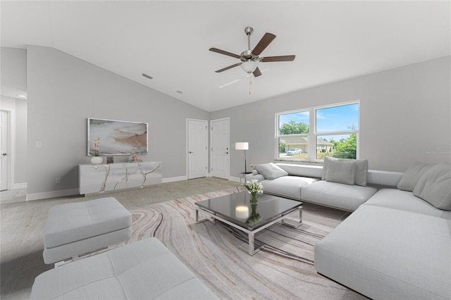 living room featuring ceiling fan and high vaulted ceiling