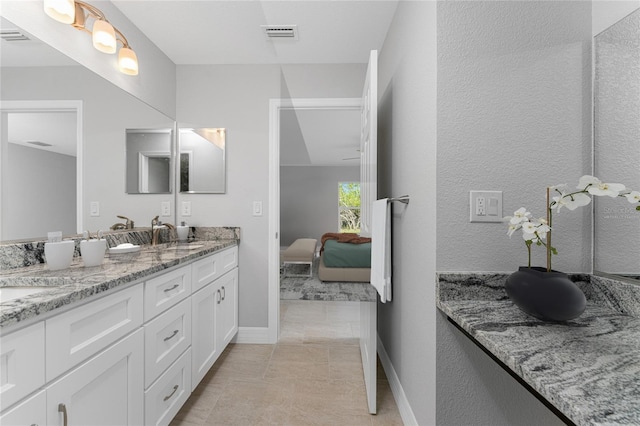 bathroom featuring vanity and tile patterned flooring